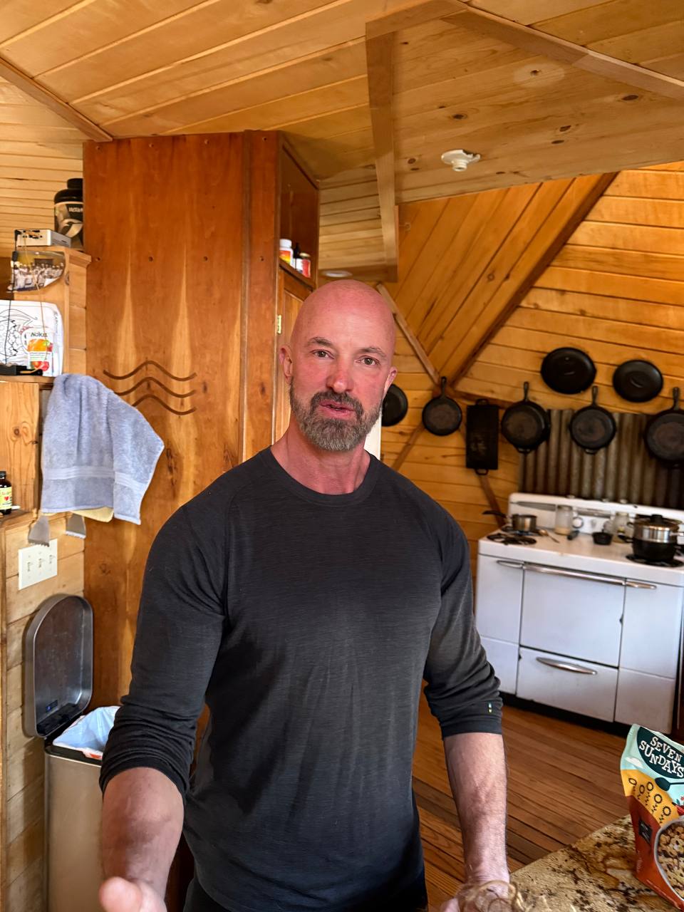 Rich, founder of Scalar Forge and competitive mountain strongman, standing in his mountain training environment